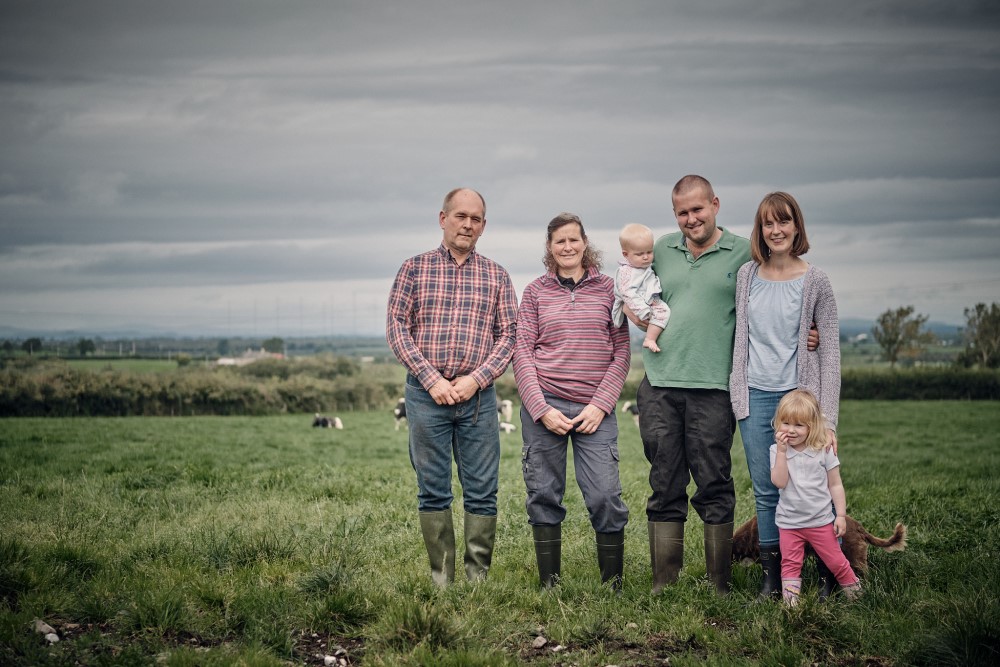 Two generations of the Bailey family stood in a field.